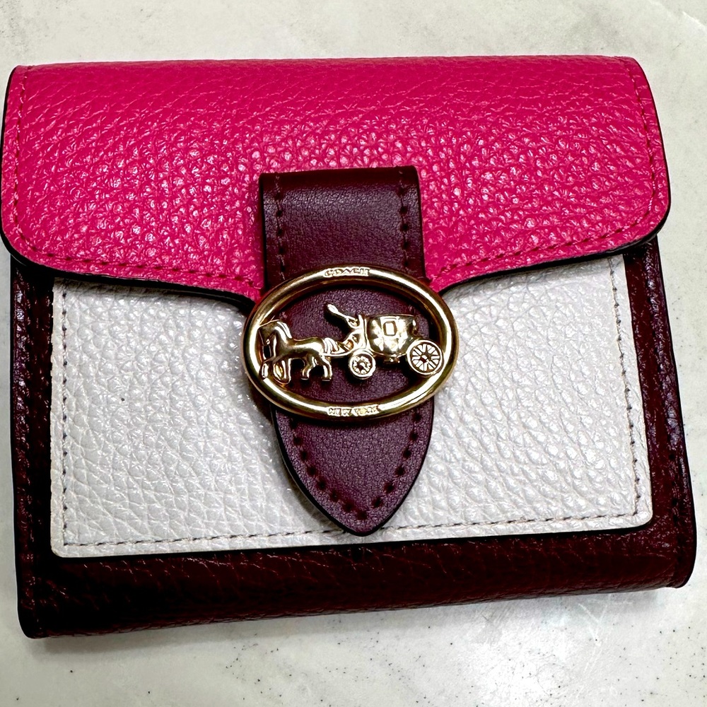 Coach mini wallet with envelope flap.